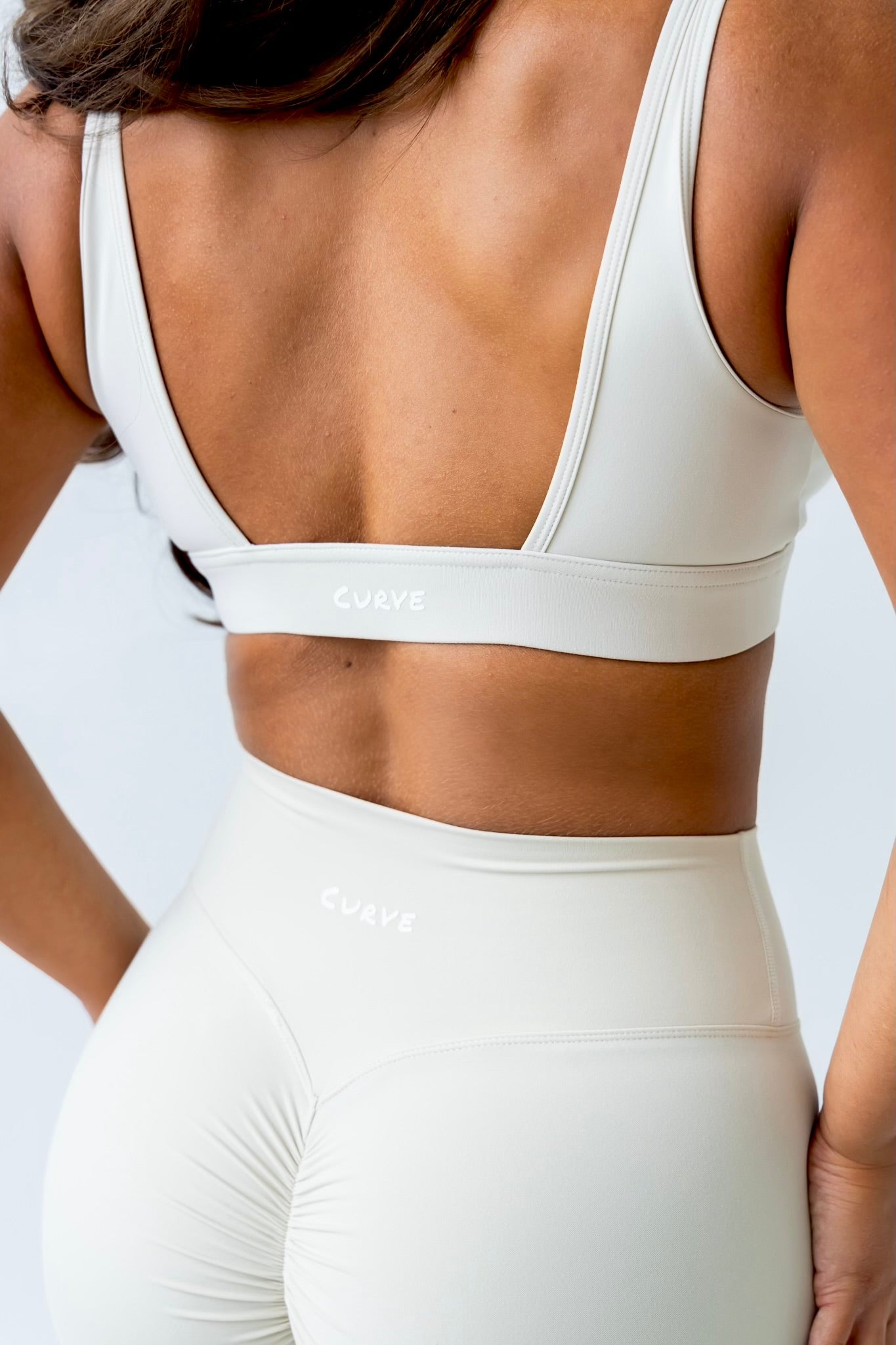 Cream deep cut sports bra